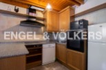 Cozy kitchen with wooden cabinets and granite countertops.