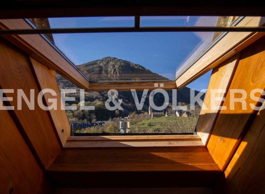 Wake up to breathtaking mountain views from this stunning attic room.