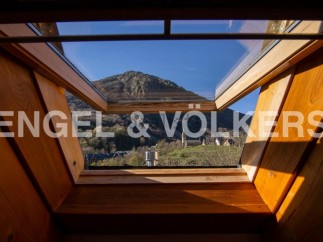 Wake up to breathtaking mountain views from this stunning attic room.