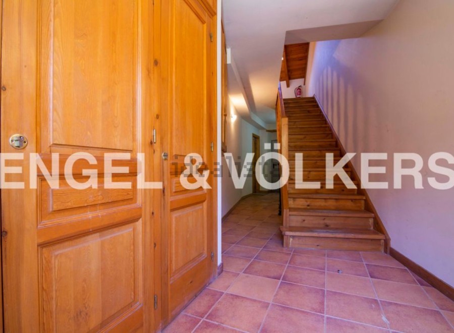 This stunning property boasts a spacious entrance hall with beautiful wooden doors and flooring.