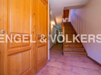 This stunning property boasts a spacious entrance hall with beautiful wooden doors and flooring.