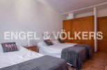 Cozy bedroom with three twin beds, perfect for families or groups.