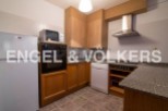 This charming apartment boasts a well-equipped kitchen with modern appliances, including a microwave, oven, and dishwasher.