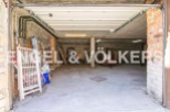 Spacious garage with ample storage space, perfect for parking and storing belongings.