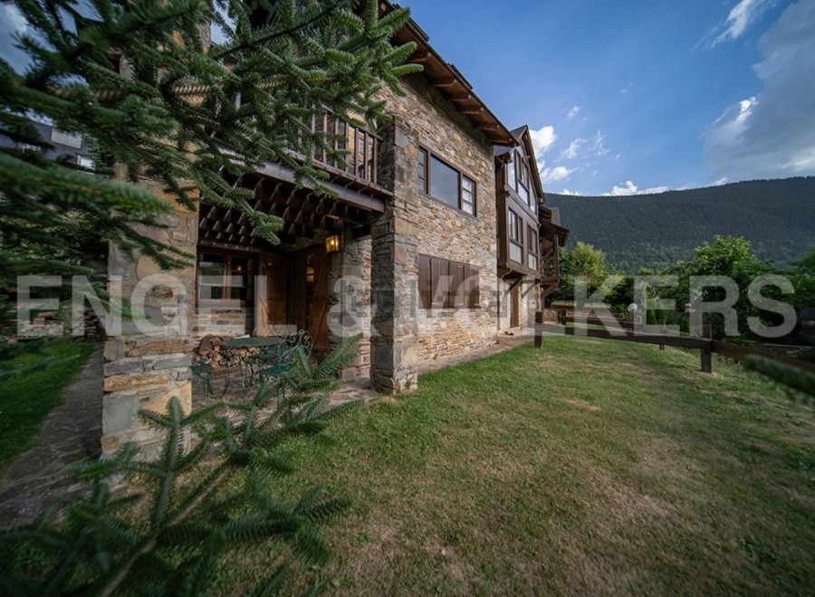 This stunning stone house boasts a spacious patio, perfect for outdoor relaxation.