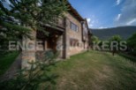 This stunning stone house boasts a spacious patio, perfect for outdoor relaxation.
