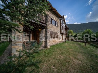 This stunning stone house boasts a spacious patio, perfect for outdoor relaxation.