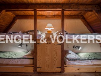 Cozy attic room with twin bunk beds, perfect for a family or friends getaway.