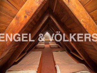 Unique attic space with multiple built-in beds, ideal for a large family or guests.
