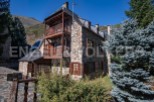 This charming stone house boasts stunning mountain views and traditional architecture.