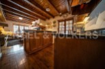 This stunning property boasts a beautiful wooden kitchen with granite countertops and custom cabinetry.