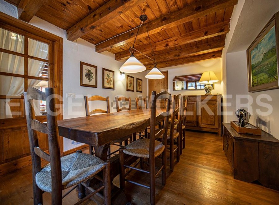 Rustic wooden dining table taking center stage in this charming country home.