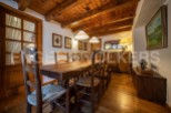 Rustic wooden dining table taking center stage in this charming country home.