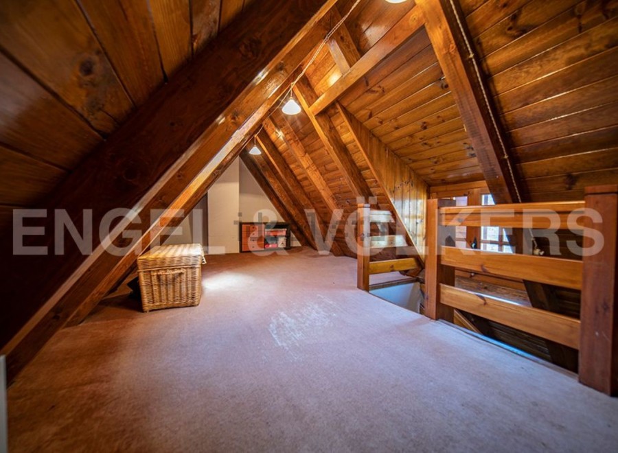 Discover this charming attic space, perfect for a cozy retreat or extra sleeping area.