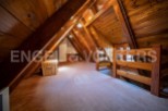 Discover this charming attic space, perfect for a cozy retreat or extra sleeping area.
