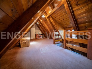 Discover this charming attic space, perfect for a cozy retreat or extra sleeping area.