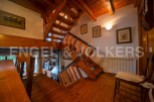 This charming property boasts a unique wooden staircase that is both functional and visually stunning.