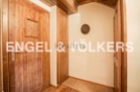 Charming wooden hallway with built-in storage and rustic details.
