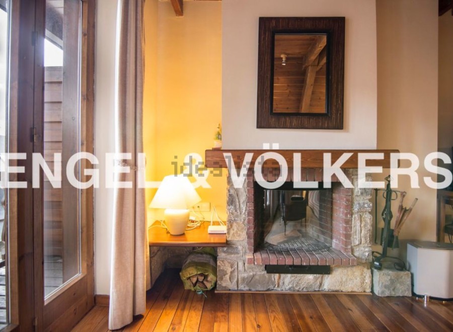 Cozy mountain retreat with a stunning stone fireplace as the centerpiece of the living room.