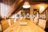 Rustic mountain chalet with a spacious dining area, perfect for family gatherings.
