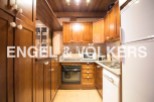 Cozy kitchen with wooden cabinets and granite countertops.