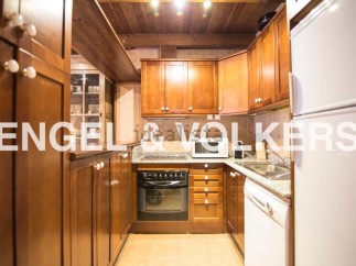 Cozy kitchen with wooden cabinets and granite countertops.