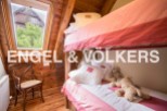 Charming wooden cabin with a cozy bunk bed, perfect for a family getaway.