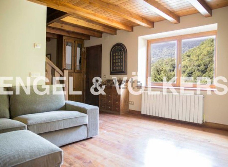 This stunning property boasts a spacious living area with large windows offering breathtaking views.