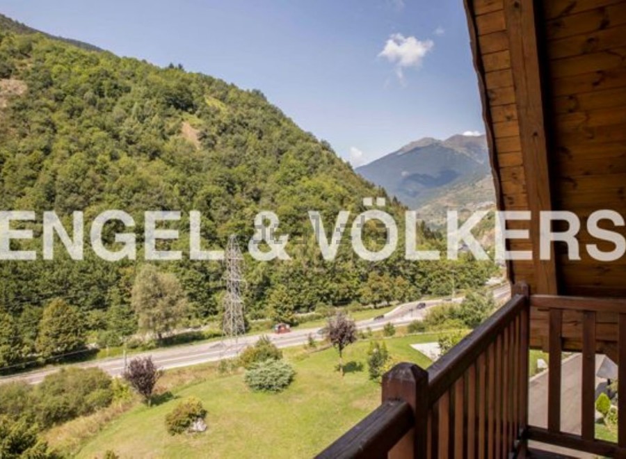 Mountain View Chalet with Balcony: Breathtaking views of the Pyrenees mountains and lush green valleys.