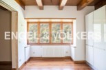 This stunning property boasts a spacious and bright interior with large windows offering breathtaking views.
