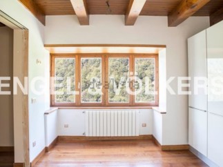 This stunning property boasts a spacious and bright interior with large windows offering breathtaking views.