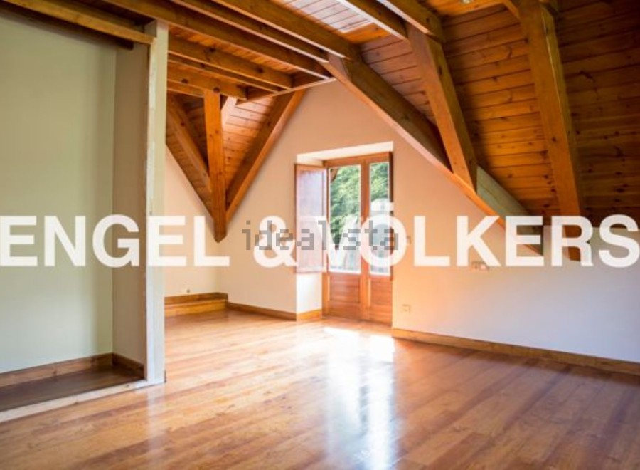 This stunning property boasts a spacious attic room with beautiful wooden beams and flooring.