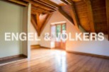 This stunning property boasts a spacious attic room with beautiful wooden beams and flooring.