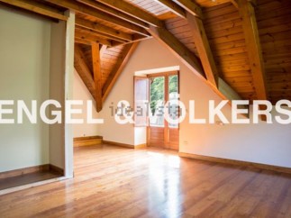 This stunning property boasts a spacious attic room with beautiful wooden beams and flooring.