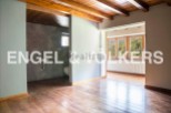 This stunning property boasts a spacious, light-filled interior with gleaming hardwood floors and high ceilings.