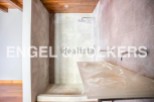 Modern bathroom with a walk-in shower and sleek countertops.