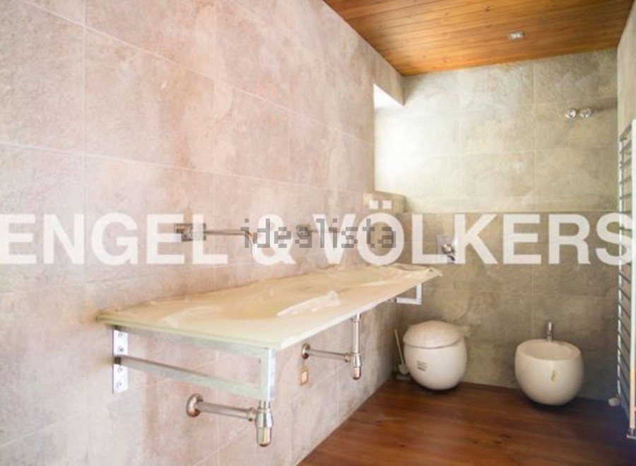 Modern bathroom with sleek floating vanity and stylish vessel sinks.