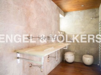 Modern bathroom with sleek floating vanity and stylish vessel sinks.