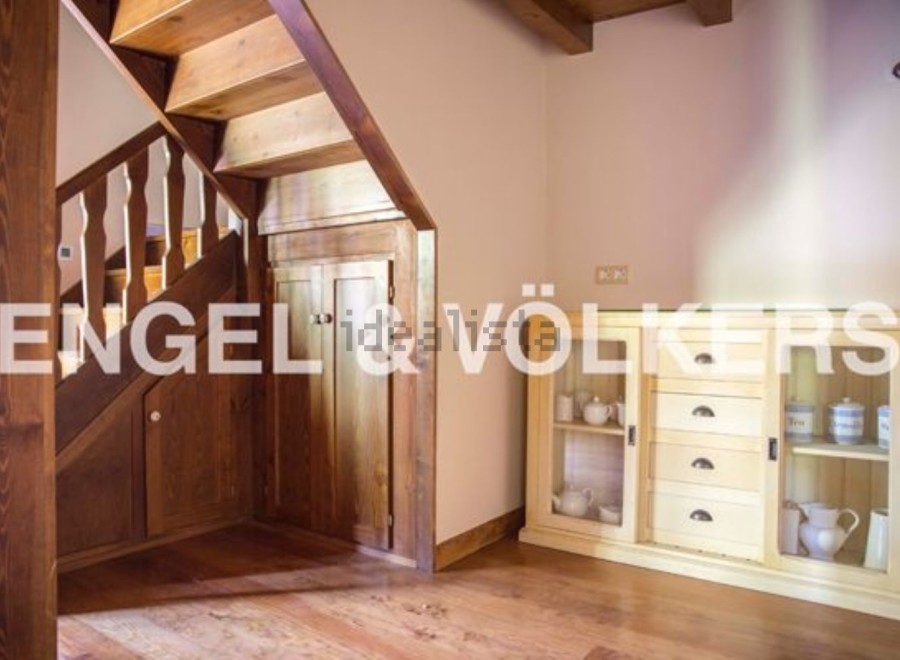 Charming wooden staircase and built-in storage add character to this home.