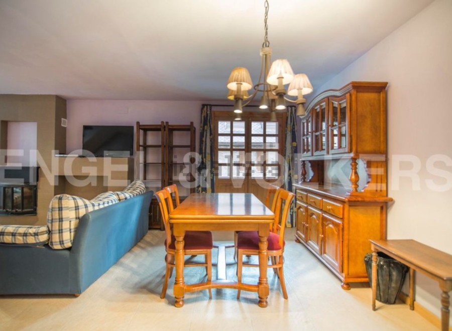 Cozy apartment featuring a spacious living area with a fireplace and comfortable seating, perfect for relaxing after a day of exploring.