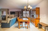 Cozy apartment featuring a spacious living area with a fireplace and comfortable seating, perfect for relaxing after a day of exploring.