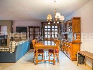 Cozy apartment featuring a spacious living area with a fireplace and comfortable seating, perfect for relaxing after a day of exploring.