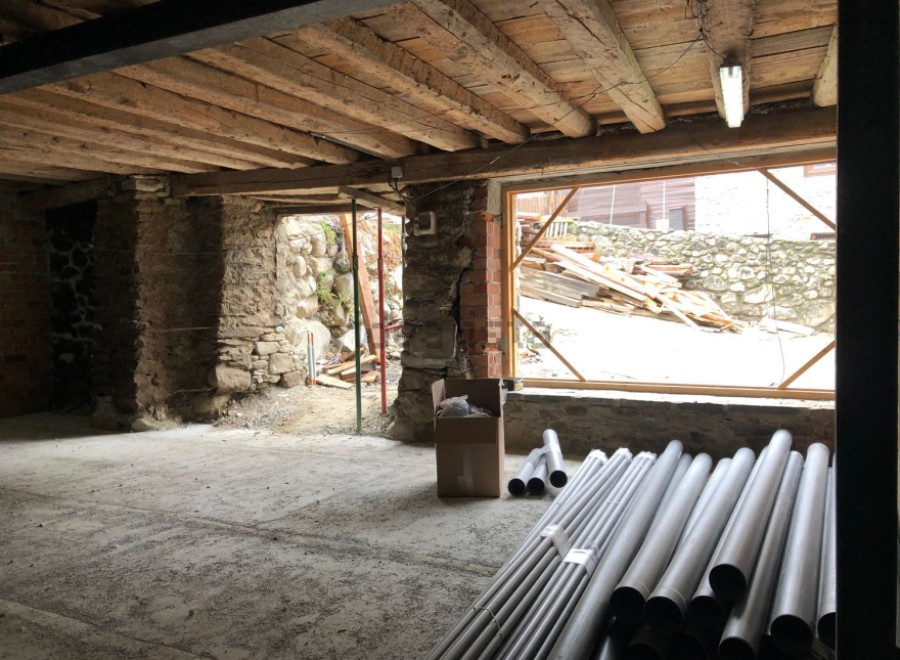 This charming property boasts exposed wooden beams and stone walls, creating a rustic and inviting atmosphere.