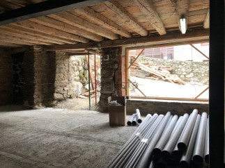 This charming property boasts exposed wooden beams and stone walls, creating a rustic and inviting atmosphere.