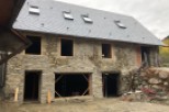 This stunning stone house boasts a newly installed slate roof, complementing its rustic charm.