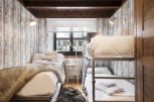 Cozy mountain cabin with rustic charm and bunk beds perfect for families or groups.