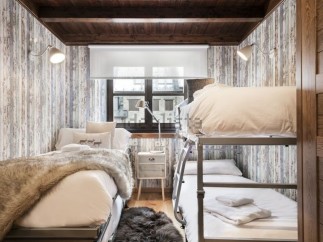 Cozy mountain cabin with rustic charm and bunk beds perfect for families or groups.