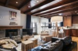 This stunning chalet boasts a spacious open-plan living area with a cozy fireplace, perfect for relaxing after a day on the slopes.