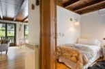 Cozy mountain cabin with rustic wood details and a comfortable bedroom.