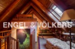Charming attic retreat with wood-beamed ceilings and skylights.